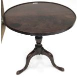 A George III Mahogany Flip-Top Tripod Table, 3rd quarter 18th century, the moulded top on a baluster