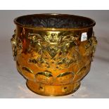 A Dutch Brass Planter, late 19th century, with lion's mask and ring handles, embossed with an