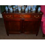 A George III Mahogany Small Sideboard, late 18th century, the moulded top above one large and two