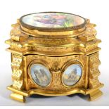 A French Gilt Metal Casket and Hinged Cover, late 19th century, of shaped oval form, inset with
