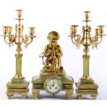 A Green Onyx and Gilt Metal Mounted Striking Mantel Clock with Garniture, circa 1900, surmounted