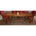 A Carved Oak Refectory Style Dining Table, 20th century, in 17th century style, the eight plank