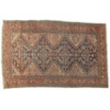 Malayir Rug West Iran, circa 1920 The indigo Herati field enclosed by madder borders flanked by