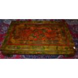 A Chinese Style Green and Red Lacquered Coffee Table, the moulded top decorated with dragons and