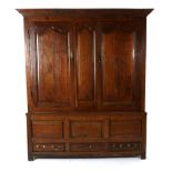 A George III Oak Press Cupboard, 3rd quarter 18th century, the bold cornice above two fielded