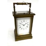 A Brass Striking and Repeating Carriage Clock, circa 1900, carrying handle and repeat button, enamel