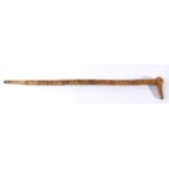 A Carved Wood Walking Stick, possibly a Welsh Love Token, 19th century, carved with a variety of