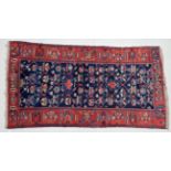 Good Bakhtiari Rug West Iran, circa 1930 The deep indigo lattice field of flowering plants