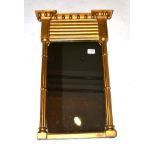 A Regency Style Gilt and Gesso Pier Glass, the rectangular plate within cluster column pilasters