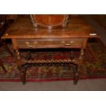 An Oak Side Table, the moulded top above a long frieze drawer raised on spiral and block legs,