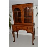 A 1920/30s Burr Walnut Display Cabinet, the upper section with arched glazed doors enclosing two