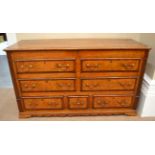 A George III Oak and Mahogany Crossbanded Mule Chest, early 19th century, the lockable hinged lid