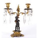 A Gilt and Patinated Bronze Figural Twin-Light Table Lustre, in Louis XV style, with leaf sheathed