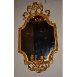 A Victorian Gilt and Gesso Two Branch Girandole, mid 19th century, with original mirror plate with