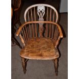 A 19th Century Yew and Elm Windsor Armchair, with double spindle back support and pierced