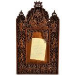 An Indian Sandalwood Photograph Frame, late 19th/early 20th century, carved and pierced with figures