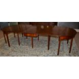A George III Mahogany D End Dining Table, early 19th century, in three sections and one original