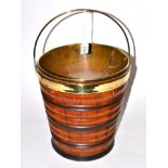A Brass Mounted Coopered Peat Bucket, of ribbed tapering cylindrical form with overhead swing handle