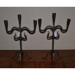 A Pair of French Wrought Iron Three-Light Candelabra, probably 18th century, with tapering sockets