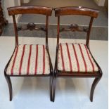 A Set of Six Rosewood Dining Chairs, circa 1820-30, the curved top rails above acanthus carved and