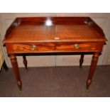 A William IV Mahogany Writing Table, 2nd quarter 19th century, the three-quarter gallery above two