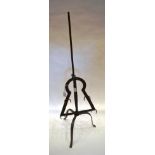 A Wrought Iron Adjustable Lark Spit, with acorn finial and six pairs of prongs, on a tripod base,