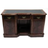 A Victorian Mahogany Inverted Breakfront Desk, late 19th century, with gilt leather inset writing