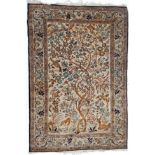 Ghom Silk Rug Central Iran, circa 1960 The ivory field with trees, birds and animals enclosed by