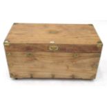A 19th Century Camphorwood and Brass Bound Trunk, with hinged lid and brass recessed handle, on