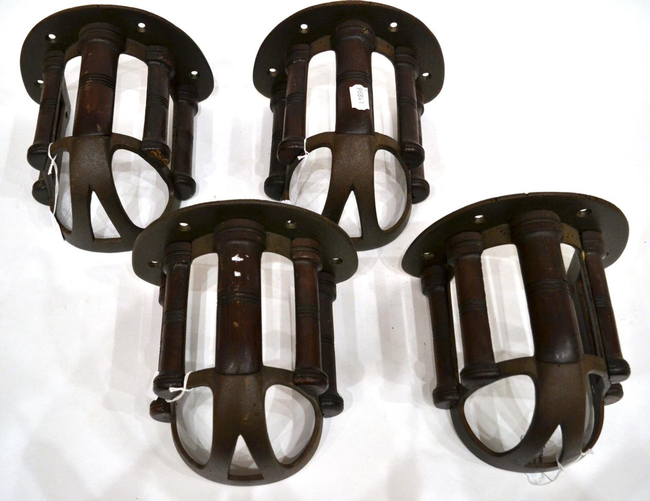 A Set of Four Musgrave's Patent Cast Iron and Mahogany Bridle Racks, early 20th century, with turned