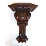 A Victorian Mahogany Carved Wall Clock Bracket, late 19th century, scroll and leaf decorated