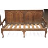 A George III Joined Oak Panel-Back Settle, early 19th century, with four moulded panels above a