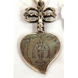 A Silver Pendant, probably English, 16th/17th century, as a sacred heart with engraved decoration