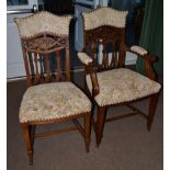 A Set of Twelve Victorian Carved Walnut Dining Chairs, late 19th century, including two carvers,