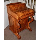 A Victorian Burr Walnut Piano-Top Davenport, circa 1860/70, the sprung top enclosing three small