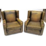 A Pair of Vintage Close-Nailed Leather Library Armchairs, 2nd quarter 19th century, with squab