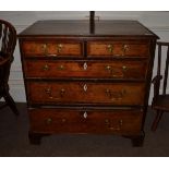A George III Oak and Crossbanded Chest of Drawers, Late 18th Century, with two short and three