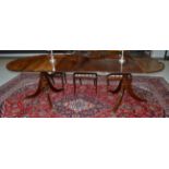 A Mahogany Twin-Pedestal Dining Table, in George III style, each pedestal with pivoting top, on