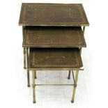 A Nest of Three Brass and Leather-Top Nesting Tables, 20th century, each with a gilt tooled