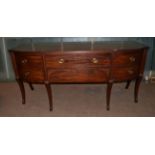 A Regency Mahogany Breakfront Sideboard, early 19th century, the central drawer with arched drawer