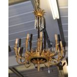 A French Empire Style Gilt and Patinated Metal Ten-Light Electrolier, with fluted column and