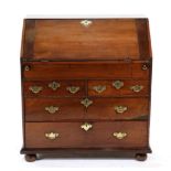 An Early 18th Century Yewwood and Pine Lined Bureau, the fall front enclosing a fitted interior of