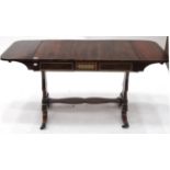 A Regency Rosewood and Brass Inlaid Sofa Table, early 19th century, the strung top with rounded drop