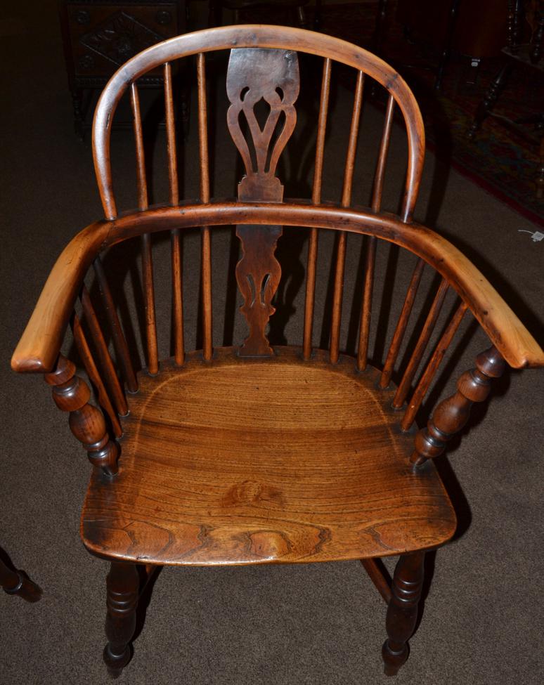 A Mid 19th Century Yewwood Windsor Armchair, the double spindle back support with pierced splat