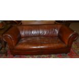 A Victorian Brown Leather Two-Seater Chesterfield Sofa, 3rd quarter 19th century, with rounded