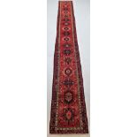 Long and Narrow Karajah Runner Iranian Azerbaijan, circa 1970 The brick red field with a column of