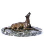 French Animalier School (early 20th century): A Bronze Figure of a Recumbent Hound, on a marble oval