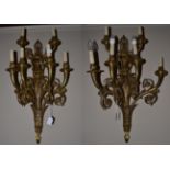 A Pair of Late 19th/Early 20th Century Brass Six-Branch Wall Lights, the oval backplate surmounted