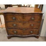 A George III Mahogany Serpentine Chest of Drawers, circa 1800, with pull-out brushing slide above