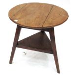 An Elm Circular Cricket Table, 2nd quarter 19th century, the three piece top on tapering legs joined